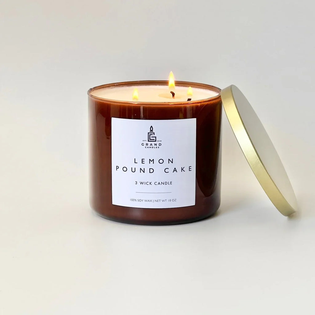 White ceramic candle with sweet lemon scent, soft glow - House of Avana