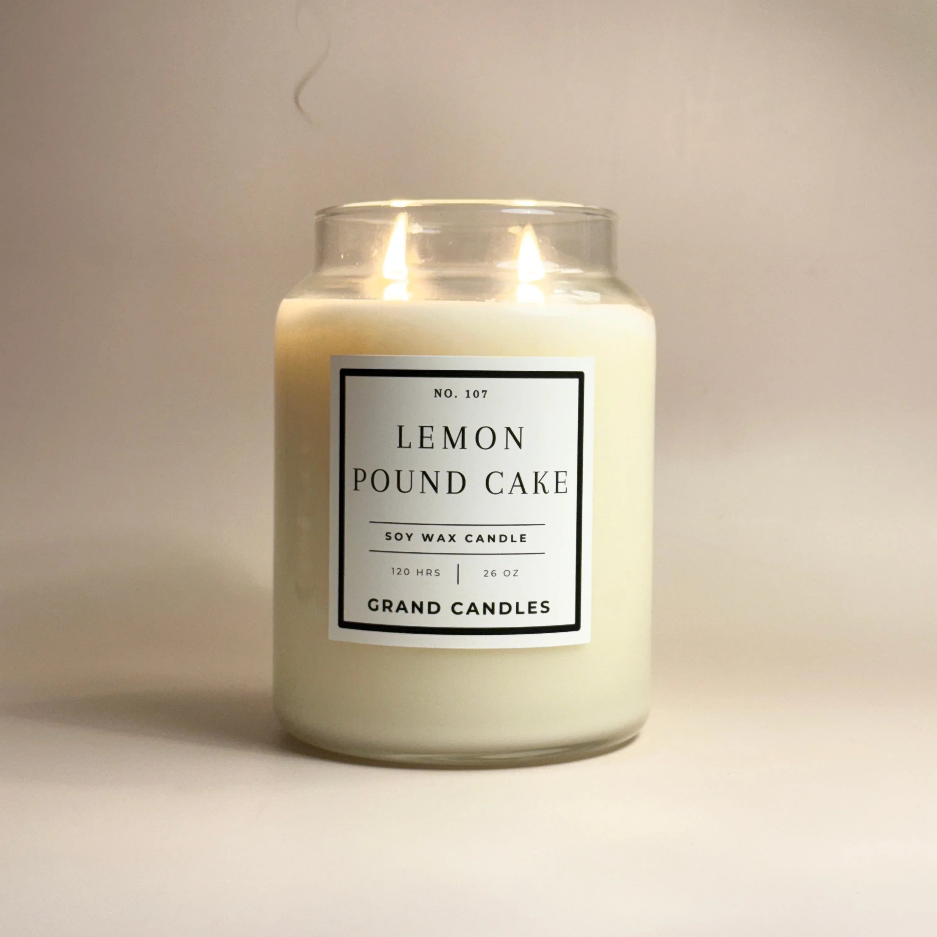White ceramic candle with sweet lemon scent, soft glow - House of Avana