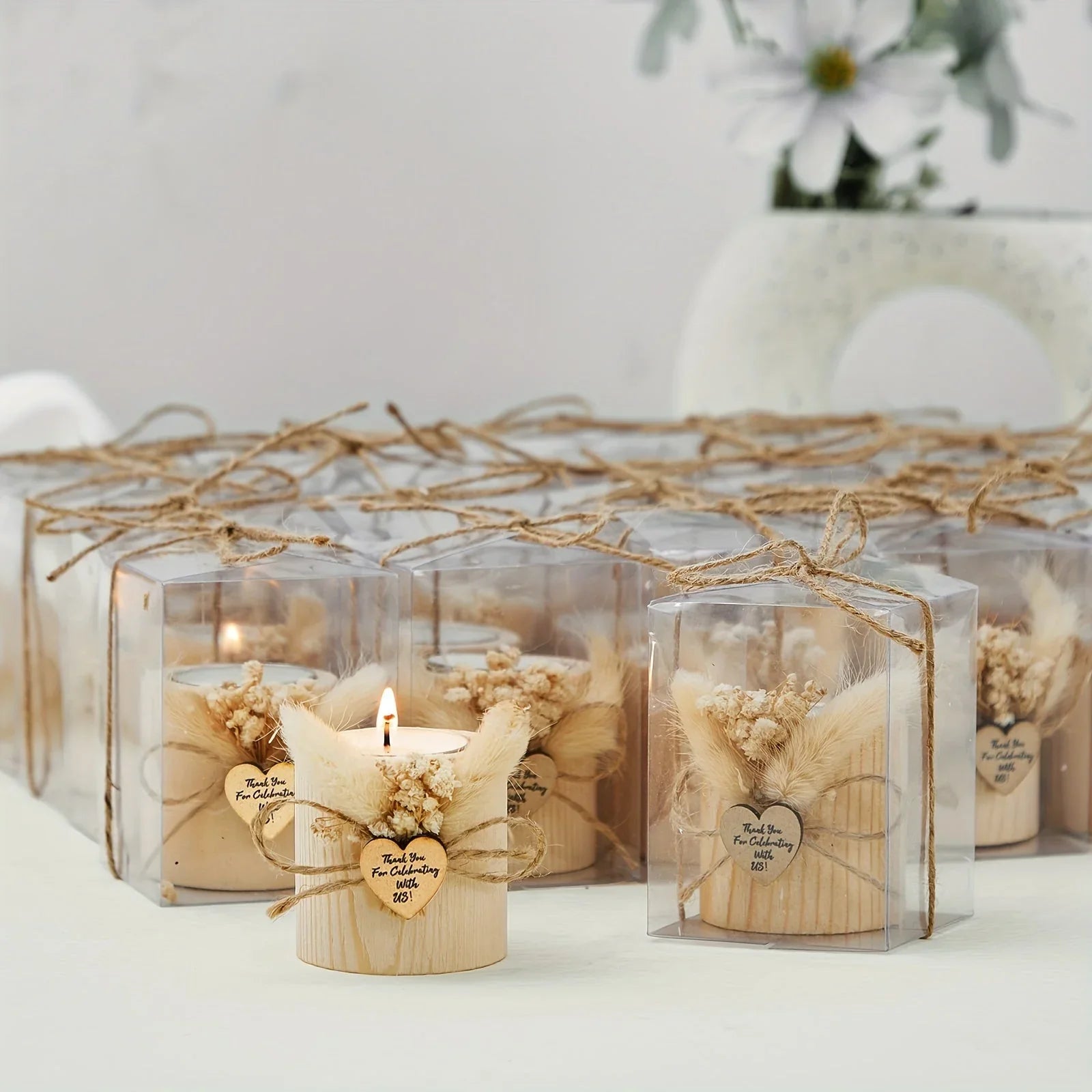 Light brown candles in decorative gift boxes, warm ambiance - House of Avana