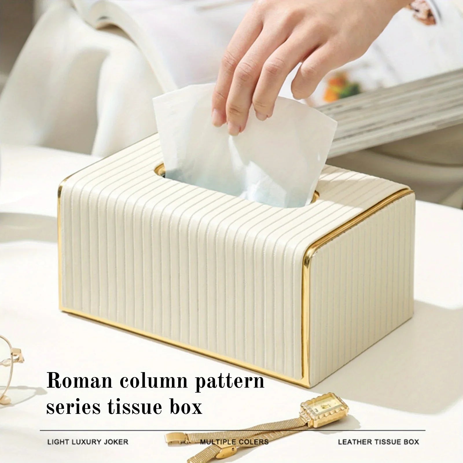 Cream striped faux leather tissue box cover with golden trim on a white table.