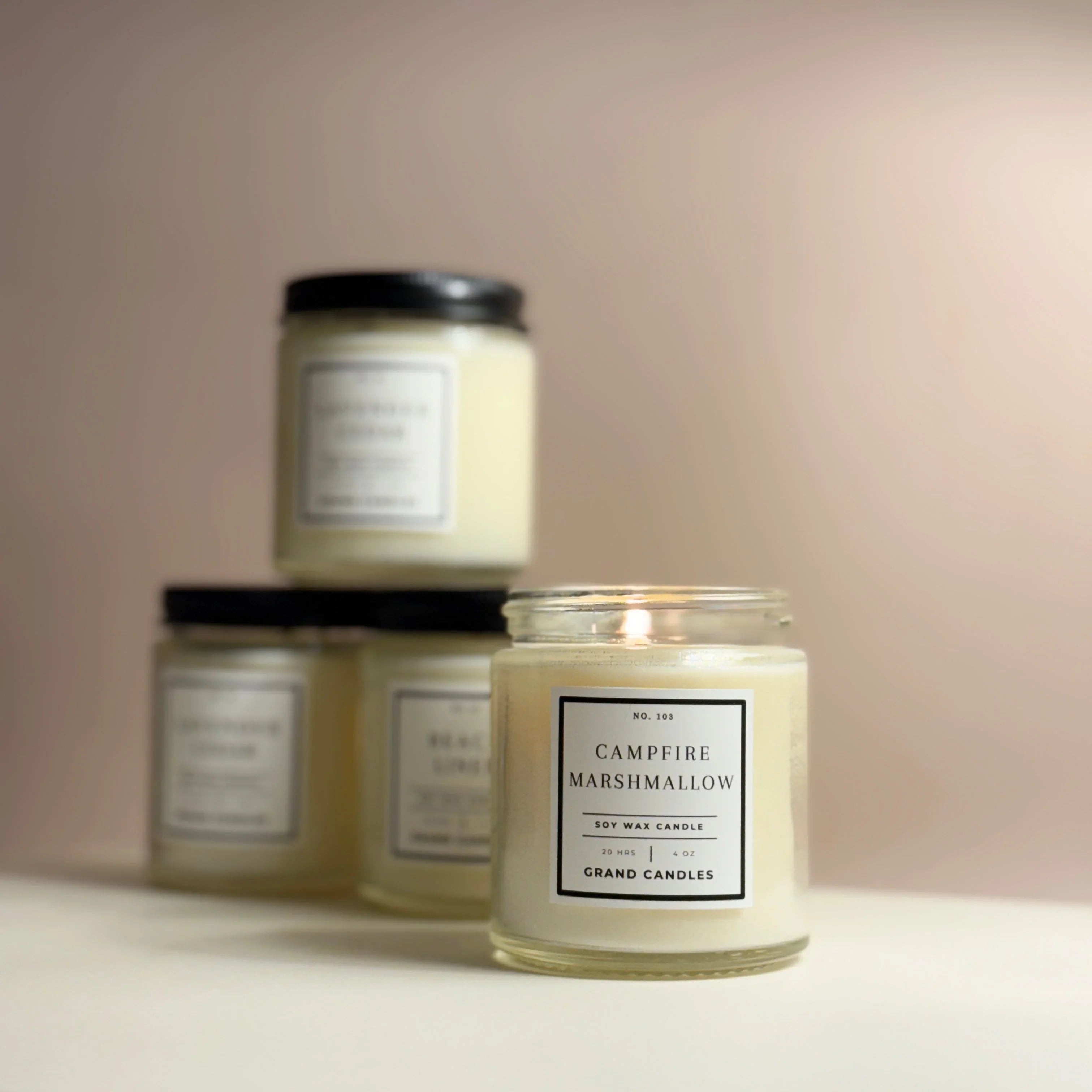 White ceramic candle with golden lid, soft glow Campfire Marshmallow scent - House of Avana