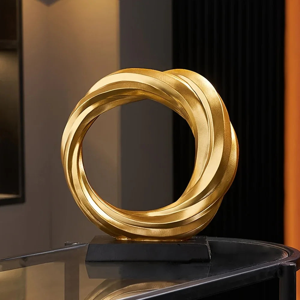 Golden metal circle sculpture, modern abstract design - House of Avana