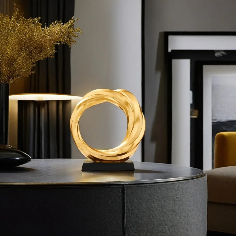 Golden metal circle sculpture, modern abstract design - House of Avana