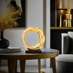 Golden metal circle sculpture, modern abstract design - House of Avana