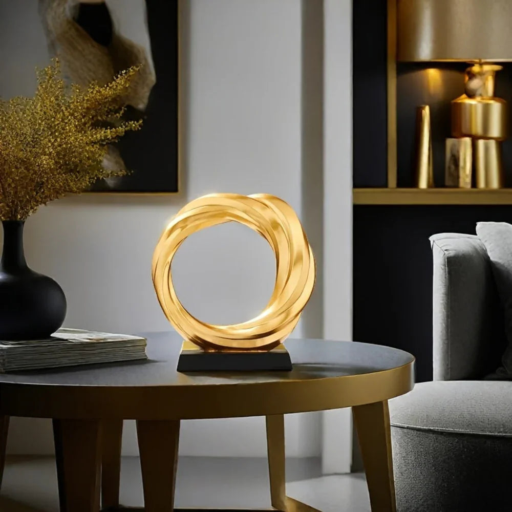 Golden metal circle sculpture, modern abstract design - House of Avana
