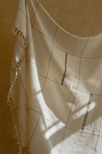 Soft beige cotton throw, hand-loomed texture, natural fibers - House of Avana