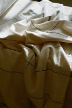 Soft beige cotton throw, hand-loomed texture, natural fibers - House of Avana