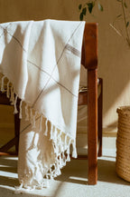 Soft beige cotton throw, hand-loomed texture, natural fibers - House of Avana