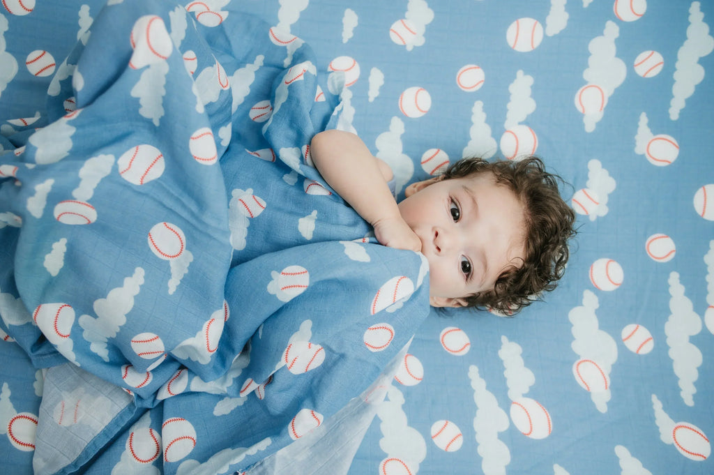 Organic Bamboo Cotton Muslin Crib Sheet in Baseballs in the Sky Cradle Comforts Co.