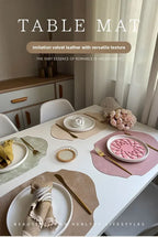 Table setting with various table mats on a dining table.