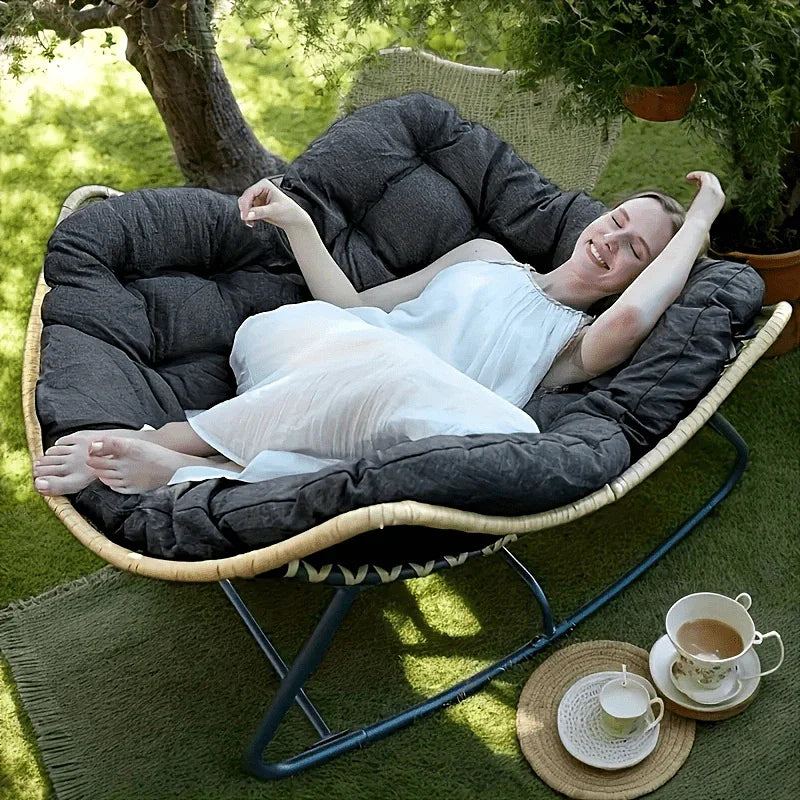 Brown rattan outdoor sofa with beige weather-resistant cushions - House of Avana