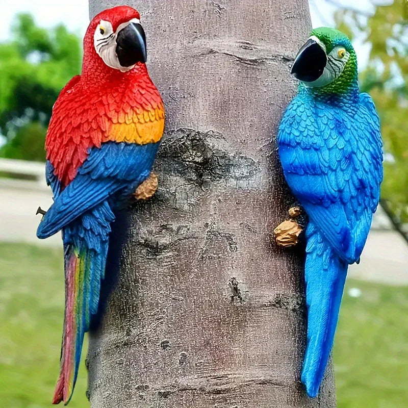 A realistic blue and green parrot statue hanging on a tree trunk as tropical garden decoration.