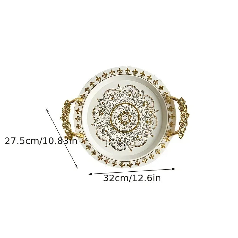 Round white serving tray with golden mandala embossing and rose-shaped handles.