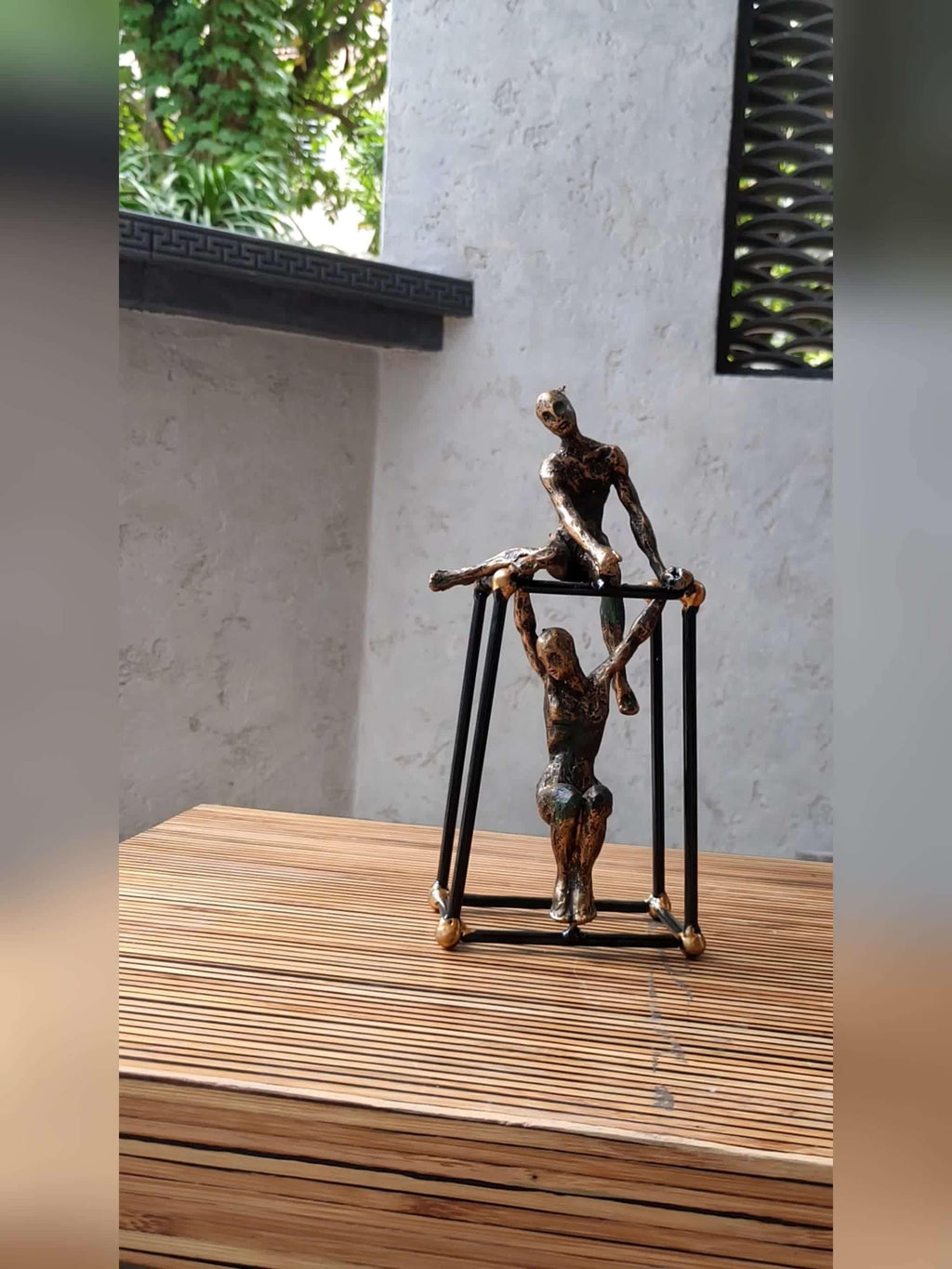 Abstract Bronze Sculpture - Two Figures Black Frame, angled view - House Of Avana
