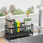 Kitchen sink caddy with cleaning utensils and a bottle of cleaner on a kitchen counter.
