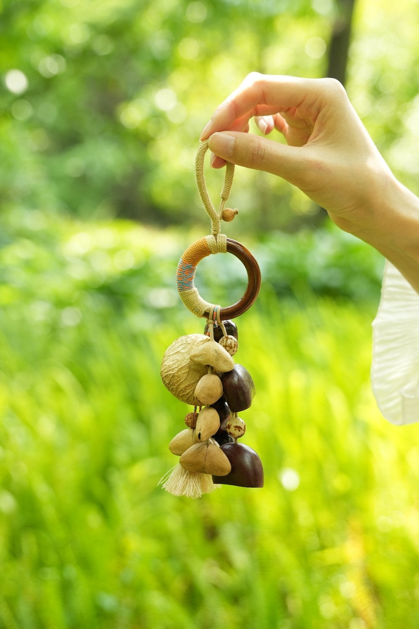 "The Artisan Hoop" - Yarn-Wrapped Wood Ring Charm with Natural Seeds & Tassel