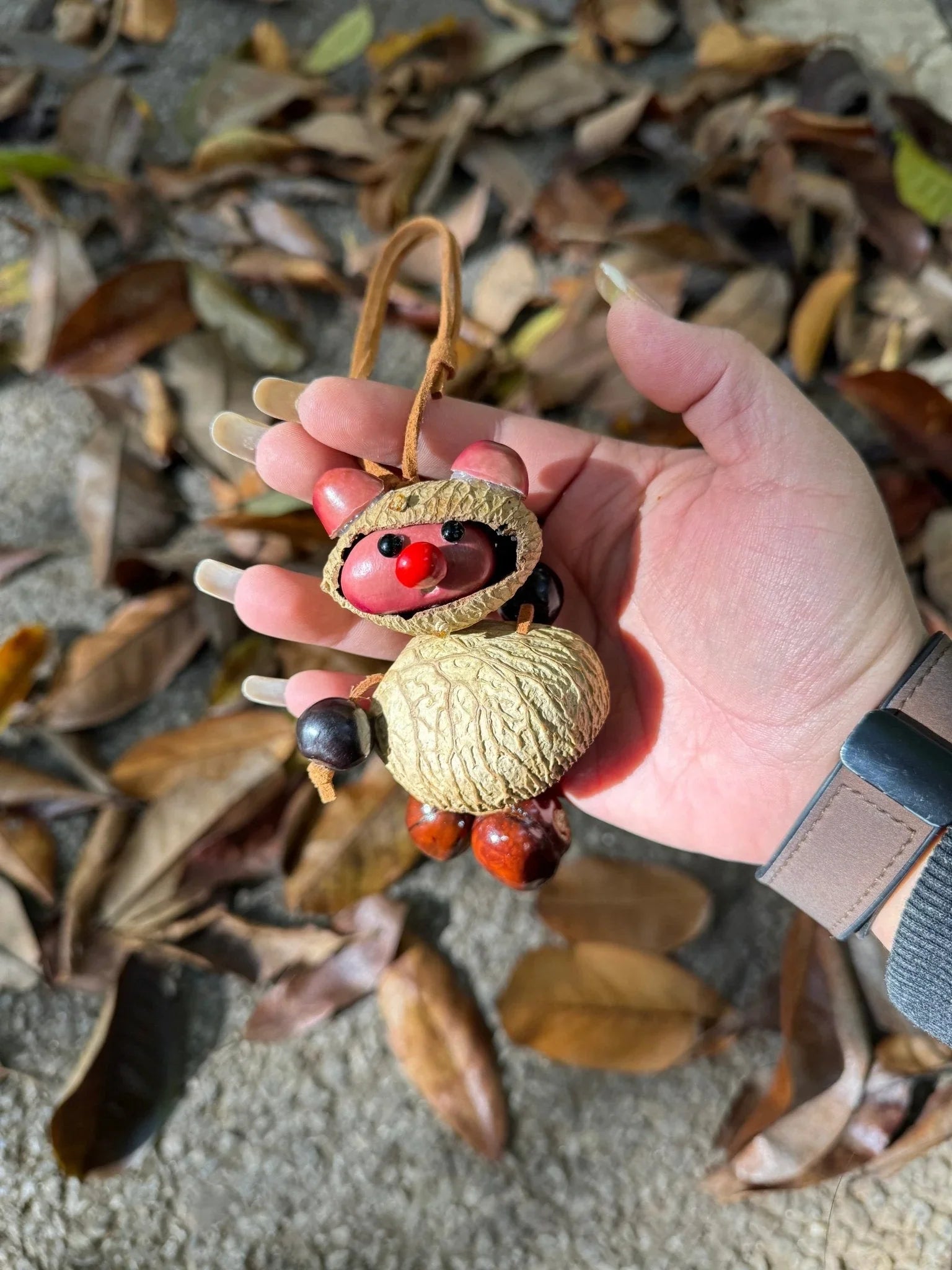 "The Little Nut Sprite" - Handcrafted Walnut Doll Charm with Painted Face
