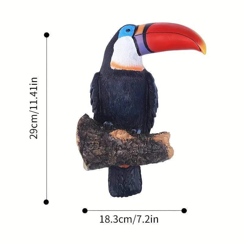 Colorful toucan figurine on a branch with measurements indicated