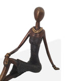 Bronze Statue of Cross-Legged African Woman in Black | House Of Avana