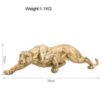Gold panther sculpture with detailed musculature in a sleek dynamic pose abstract gold panther figurine
