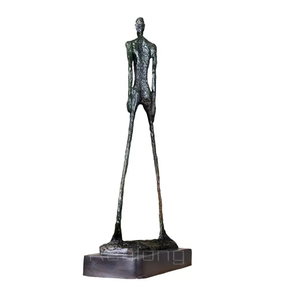 Abstract walking man sculpture featuring a tall slender bronze figure with elongated limbs and textured metal surface