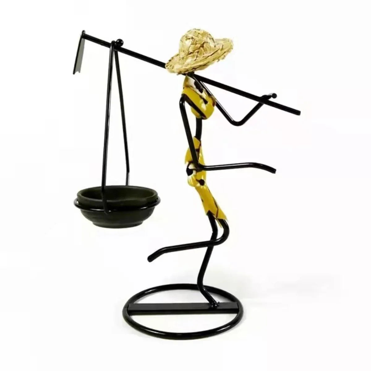 Decorative black metal candle holder figurine wearing straw hat and yellow patterned clothing for home decor