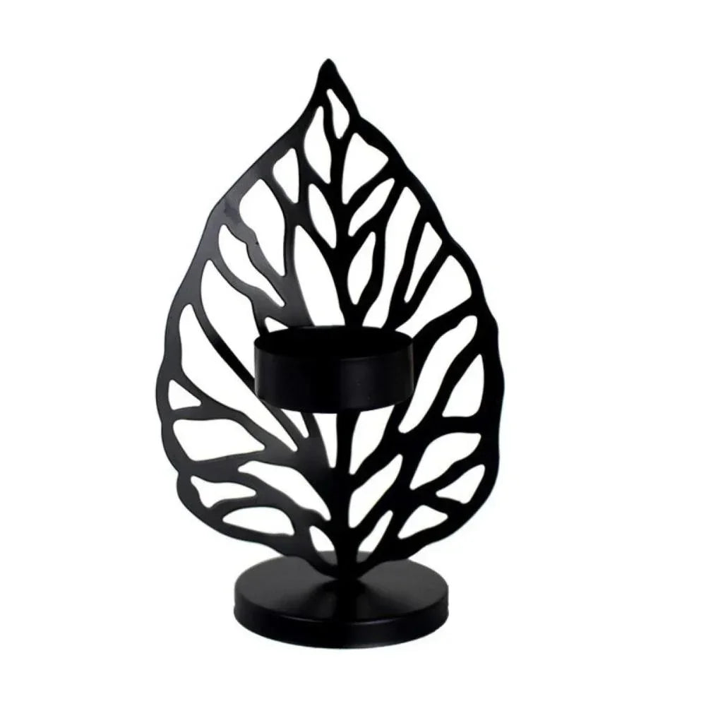 Black metal leaf metal candle holder with intricate cutout design for decorative use