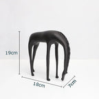 Modern minimalist black horse sculpture with matte finish, stylized elongated legs, and textured mane figurine
