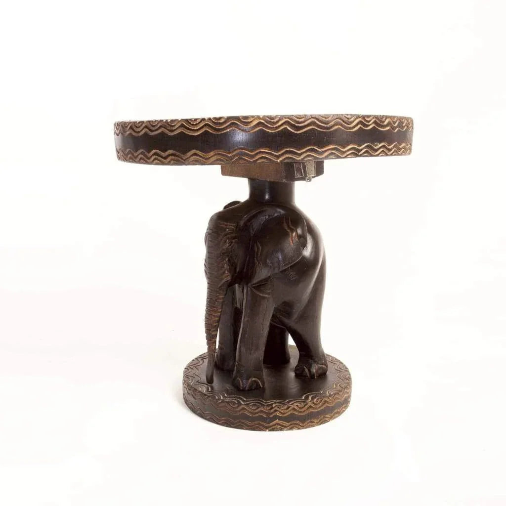African hand-carved wooden side table with an elephant base and decorated round top