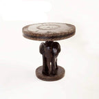 Hand-carved African wooden side table with elephant base and decorative patterns