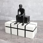 Bronze modern thinker statue, long-legged figurine, metallic finish - House of Avana