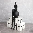 Bronze modern thinker statue, long-legged figurine, metallic finish - House of Avana