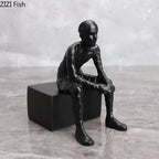 Bronze modern thinker statue, long-legged figurine, metallic finish - House of Avana