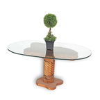 West African handmade teak log accent table with glass top and small potted plant